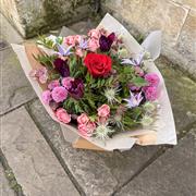 Florist choice bouquet with 1 Red rose in middle 